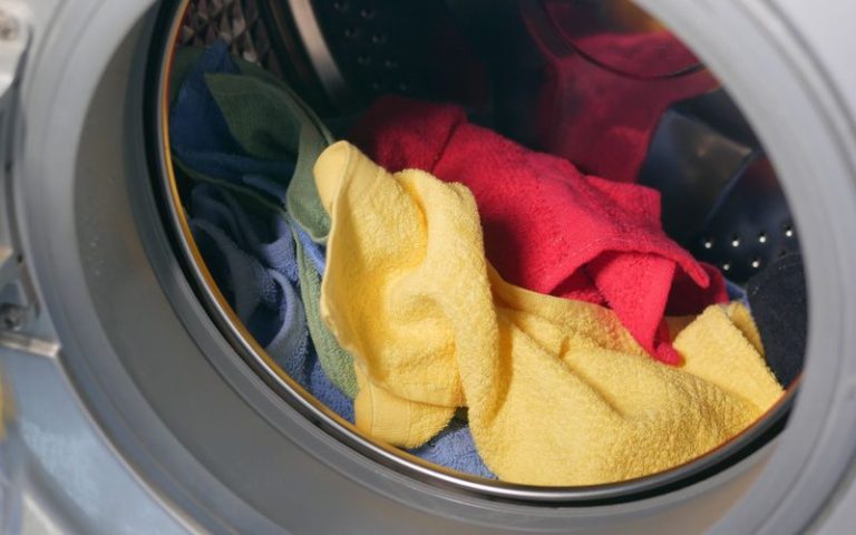 Clothes tumbling inside the drum of a front load washing machine